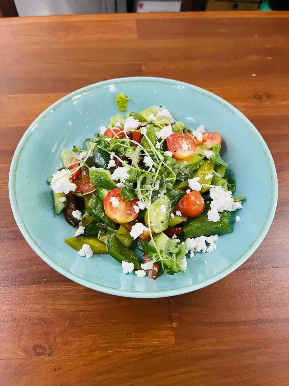 A crisp salad of cucumber, tomato, olives and feta