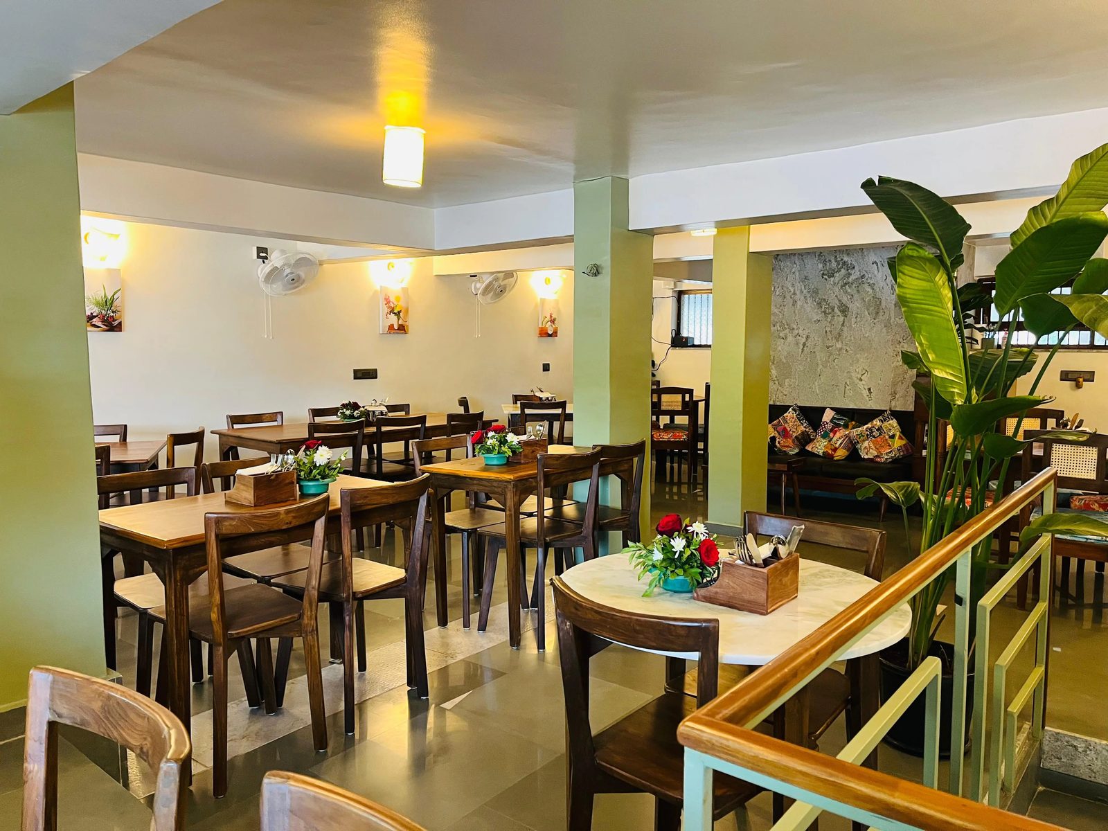 The main dining room at TRYST, tables set with fresh flowers under warm lights